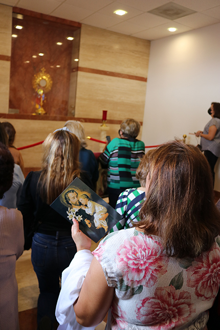 Faithful of Prince of Peace pray in the new chapel of St. Joseph moments before it was blessed by Archbishop Thomas Wenski, March 19, 2022.