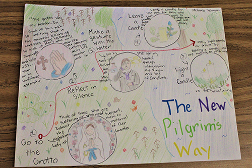 A closer look at the illustrations on The New Pilgrim's Way map made by Little Flower School student Melania Selman shows details and instructions. Projects like this were on display May 18, 2022 at Little Flower School in Hollywood, which was converted into a "pilgrimage to Lourdes experience."