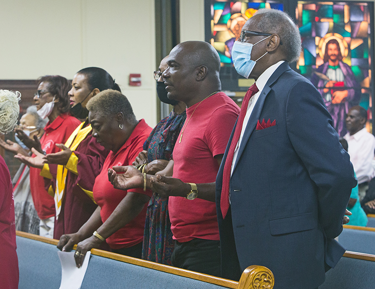 Donald Edwards, far right, associate superintendent of Schools for the archdiocese, joins other Black Catholics gathered at St. Helen Church, Lauderdale Lakes, Aug. 21, 2022, for the annual Unity Mass, celebrated by Archbishop Thomas Wenski.