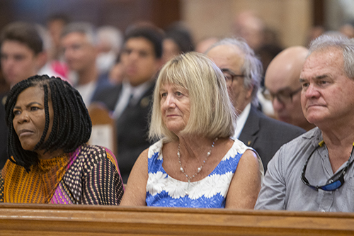 Archbishop Thomas Wenski's sister, Mary Engle, center, watches from a front pew during the Mass marking his 25th anniversary as a bishop, Sept. 3, 2022 at St. Mary Cathedral.