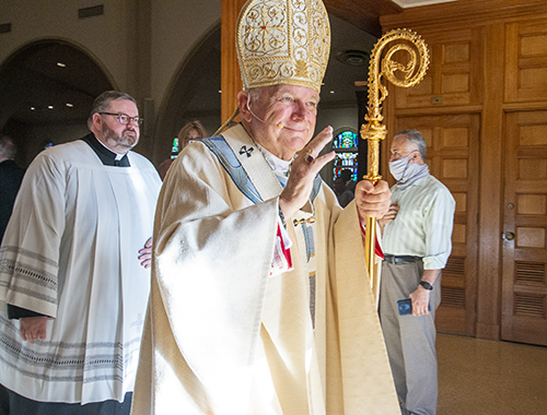 Archbishop Thomas Wenski blesses the congregation as he exits St. Mary Cathedral Sept. 3, 2022 after the Mass marking the 25th anniversary of his ordination as a bishop.