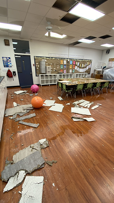 Ceiling tiles and water damage are visible in a classroom at Epiphany Cathedral School in the Diocese of Venice after the passage of Hurricane Ian.
