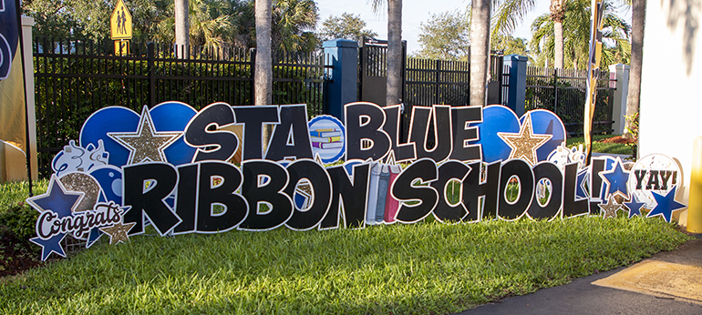 Sign at the entrance to St. Thomas Aquinas as it celebrated its 2022 Blue Ribbon designation as an Exemplary High Performing High School, Oct. 3, 2022. It was one of only two schools in Florida to earn the award, given to only 297 schools throughout the U.S. This is the third time St. Thomas has been awarded this distinction.