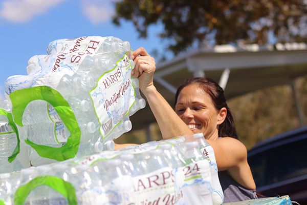 At the the Elizabeth Kay Galeana Catholic Charities Center in Fort Myers, volunteer Melissa Stevens helps with the water and emergency supplies distribution on Oct 4, 2022, approximately one week after Hurricane Ian passed over southwest Florida.