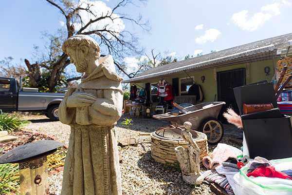 A statue of St. Francis of Assisi remains standing outside the home of Fort Myers resident and art instructor Elizabeth Reyes and her husband, Luis Reyes, an employee of Catholic Charities of the Diocese of Venice, on Oct. 5, 2022. Hurricane Ian brought at least three inches of rain into the Reyes family residence on Sept. 28 and a fallen tree also pulled the power line from the home.