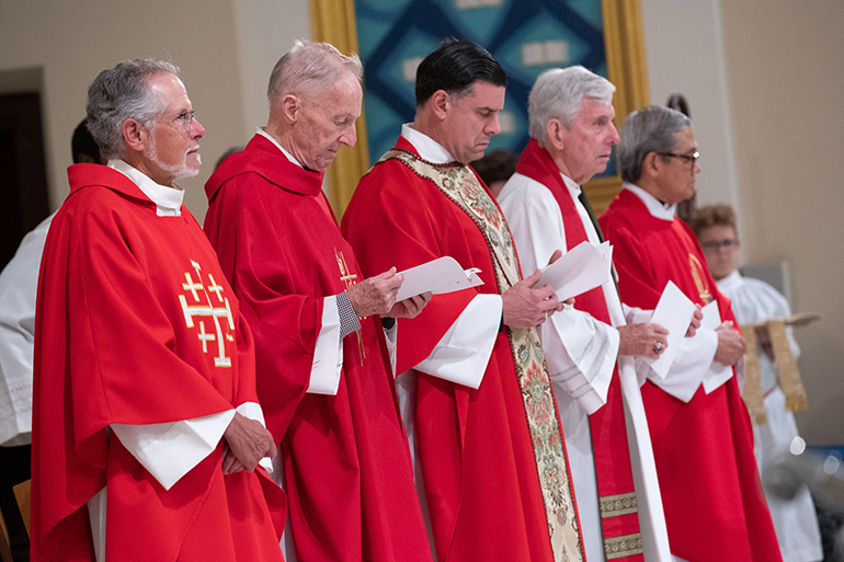 Archdiocesan priests take part in the 31st annual Red Mass for Broward County legal professionals, presided by Archbishop Thomas Wenski and hosted by the St. Thomas More Society of South Florida, Oct 18, 2022 at St. Anthony Church in Fort Lauderdale. From left: Father Bob Tywoniak, pastor of Blessed Sacrament Parish, Fort Lauderdale; Father Patrick O'Neill, former president of St. Thomas University in Miami Gardens; Father Rafael Capo, vice president of Mission for St. Thomas University; Father Michael Greer, pastor of Assumption Parish in Lauderdale-By-The-Sea, and Father Gary De Los Santos, administrator of St. John the Baptist Parish in Fort Lauderdale.