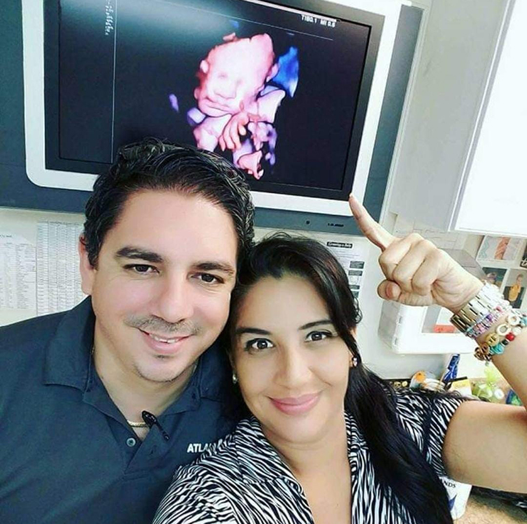 Luz Alba and her husband, Ivanovich, pose for a selfie with the sonogram of their daughter Genesis, now 5. The Albas considered having an abortion because Luz had just come out of cancer treatments and lost a previous pregnancy at seven months.