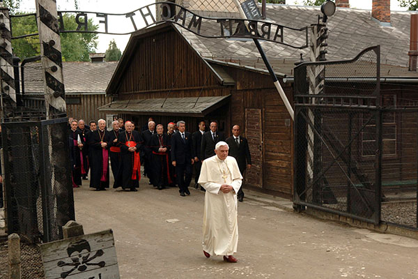 Pope Benedict XVI visit the former Auschwitz death camp in Oswiecim, Poland, May 29, 2006. "To speak in this place of horror, in this place where unprecedented mass crimes were committed against God and man is almost impossible -- and it is particularly difficult and troubling for a Christian, for a pope from Germany," he said at the time. Pope Benedict died Dec. 31, 2022, at the age of 95 in his residence at the Vatican. (OSV News photo/Giancarlo Giuliani, Catholic Press Photo)