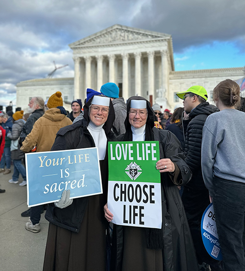 Carmelite Sisters Shawn Pauline, left, and Rosalie Nagy, of St. Theresa School in Coral Gables, accompanied over 90 young people from Miami who took part in first post-Roe March for Life, traveling to Washington, D.C., Jan. 18-21, 2023. The pilgrimage was led by Stephen Colella, director of the Office of Parish Life, and Father Manny Alvarez, pastor of the Church of the Little Flower in Coral Gables.