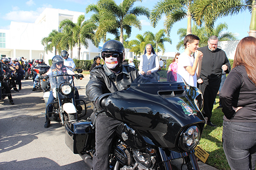 Archbishop Thomas Wenski, wearing his leather jacket and mask, prepares to lead the 350 bikers who accompanied him on the Archbishop's 2023 Motorcycle Ride held Jan. 29, 2023, an annual fundraiser for St. Luke’s Center for drug and alcohol addiction rehabilitation.