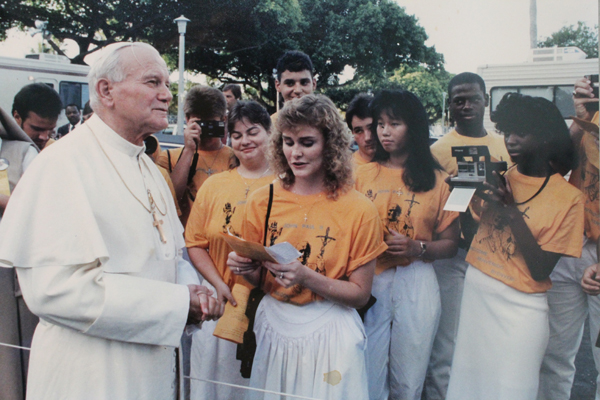 During Pope John Paul II's visit to Miami in September 1987, a small group of young leaders, some from Encuentros Juveniles, serenated the pontiff in English, Spanish, Creole and Polish outside Archbishop Edward McCarthy's residence. This photo, and many other items of Encuentros Juveniles, are on exhibit through May 2023 at the Archbishop John C. Favalora Archive and Museum at St. Thomas University in Miami Gardens.