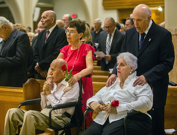 Rosario and Juan Quintana de Salas, left, married 55 years, and Armando and Enriqueta Larrea, married 63 years, renew their marriage vows during the annual Mass honoring sacramental marriage and couples celebrating milestone anniversaries. The Mass was celebrated by Archbishop Thomas Wenski Feb. 18, 2023 at St. Mary Cathedral in Miami.