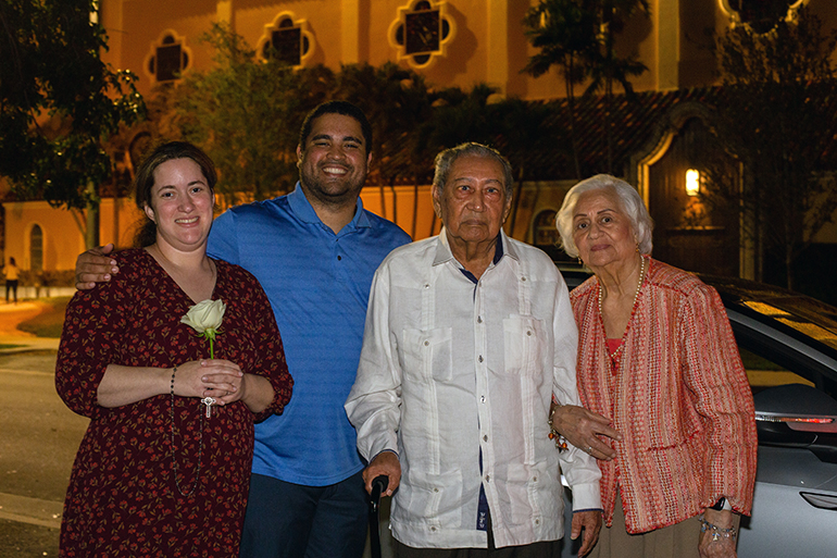 Nathalie and Pedro Gonzalez-Mourin, married one year, pose for a photo with Martin and Ozema de Jesus, married 72 years, after the annual Mass honoring sacramental marriage and couples celebrating milestone anniversaries. The Mass was celebrated by Archbishop Thomas Wenski Feb. 18, 2023 at St. Mary Cathedral in Miami.