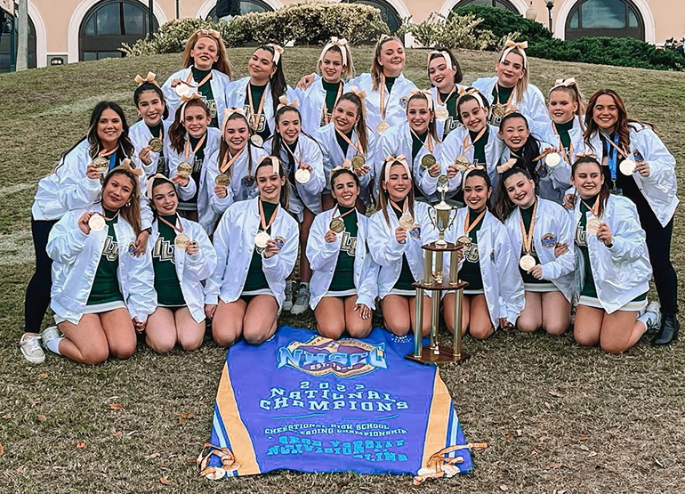 Immaculata-La Salle's cheerleaders pose after winning the national championship in Large Varsity Non-Tumbling Division II in Orlando, Feb. 12, 2023.