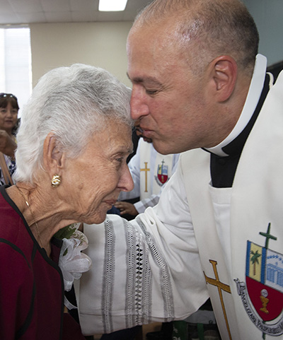 Father Elkin Sierra kisses his mother, Stella Sierra, after giving her one of his first blessings.




At a standing-room only St. Mary Cathedral, nearly 1,000 people witnessed the joyous, tradition-filled Mass of ordination for five new priests for the Archdiocese of Miami, May 11, 2019.