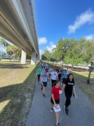 More than 250 youths, young adults and families from approximately 12 schools and parishes in the Archdiocese of Miami took part in the six-mile Via Crucis, coordinated by the Malta Youth Corps, from St. Augustine Church in Coral Gables to the Shrine of Our Lady of Charity in Miami, April 1, 2023.