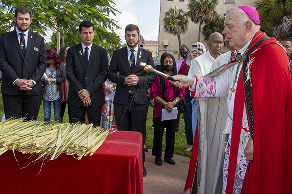 Archbishop Thomas Wenski blesses the palms at the start of the Palm Sunday Mass at St. Mary Cathedral, April 2, 2023.