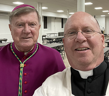Father Michael Davis, right, pastor of St. Gregory the Great Parish in Plantation, takes a selfie with Worcester, Massachusetts Bishop Robert J. McManus, who also was honored by the Catholic Education Foundation with a Lifetime Achievement Award at a ceremony held in New York, April 26, 2023.