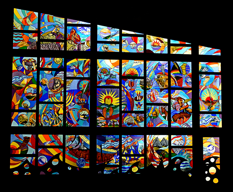 Wall of stained glass at Temple Beth Emet in Cooper City illustrates major moments in Jewish history: from the Creation, lower right, through the giving of the Law in the center, to the rebirth of Israel at the left.