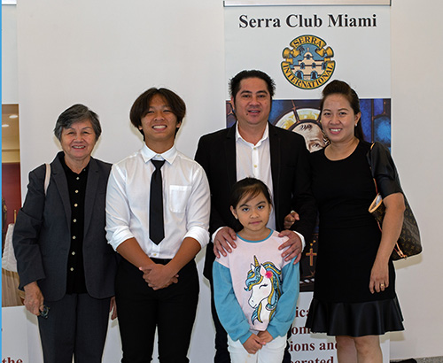 Altar server Gia Chau, 14, second from left, poses with his grandmother, Hien Nguyen; father, Choung Nguyen; mother, Thi Nguyen; and sister, Khanh Bang Nguyen, 7, after the annual Mass and Altar Server Awards ceremony sponsored by the Miami Serra Club. It took place April 30, 2023, at St. Raphael Chapel on the campus of St. John Vianney College Seminary in Miami, with Auxiliary Bishop Enrique Delgado presiding along with archdiocesan Vocations Director Father Matthew Gomez.