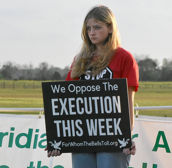 A student from Lourdes Academy Catholic School in Daytona Beach, Fla., stands for life in front of the Florida State Prison Feb. 23, 2023. The Florida Conference of Catholic Bishops wrote a May 31 letter to Gov. Ron DeSantis, who is Catholic, asking him to stay the execution of death-row inmate Duane Owen and commute his sentence to life without parole. (OSV News photo/Glenda Meekins, Florida Catholic)