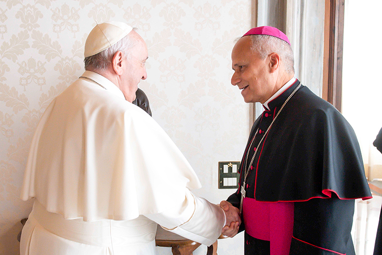 Pope Francis greets Archbishop Robert F. Prevost, a Chicago native, during a private audience at the Vatican Feb. 12, 2022.  The pope will elevate Cardinal-designate Prevost, who is prefect of the Dicastery for Bishops, to the College of Cardinals during a special consistory at the Vatican Sept. 30. (CNS photo/Vatican Media)