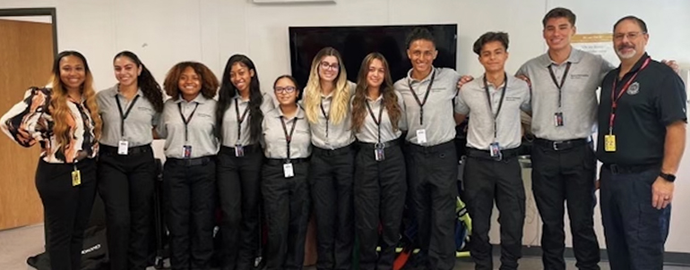 Jamie Argüello, third from the left, poses with fellow students in the the EMT Academy, from which she graduated.