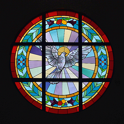 A flying dove, an ancient symbol for the Holy Spirit, forms the rose window at Notre Dame d'Haiti.