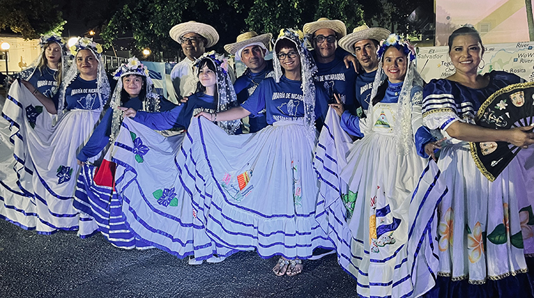 Young people wear their typical Nicaraguan dress as part of the "Gritería Chiquita" (small shouting) to the Virgin Mary, after the Mass celebrated Aug. 15, 2023 at St. John the Apostle Church, Hialeah.