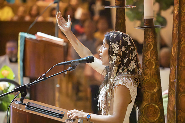 Stephanie Guevara sings the Responsorial Psalm during the Mass celebrating St. Louis Church’s 60th anniversary, Sept. 10, 2023.