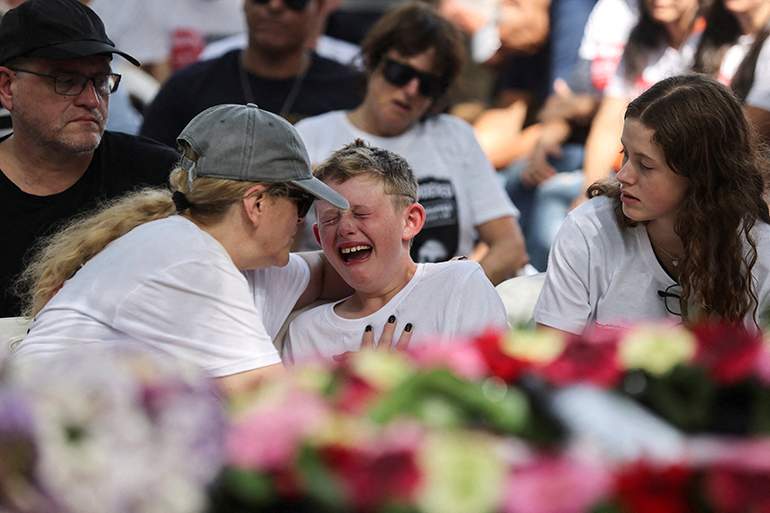 Shahar Idan, 9, reacts during a funeral for his brother Maayan in kibbutz Einat, Israel, Oct. 22, 2023. Maayan, 18, was killed following a deadly infiltration by Hamas gunmen in kibbutz Nahal Oz, and the brothers' father, Tzahi, was kidnapped and taken to to the Gaza Strip. (OSV News photo/Tomer Appelbaum, Reuters)