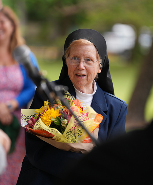 Sister Elizabeth Worley, a Sister of St. Joseph of St. Augustine marking 60 years in religious life, smiles during the tribute at Immaculata-La Salle High School in Miami where the chemistry lab was renamed in her honor, Oct. 26, 2023. She began teaching chemistry at the high school 50 years ago.