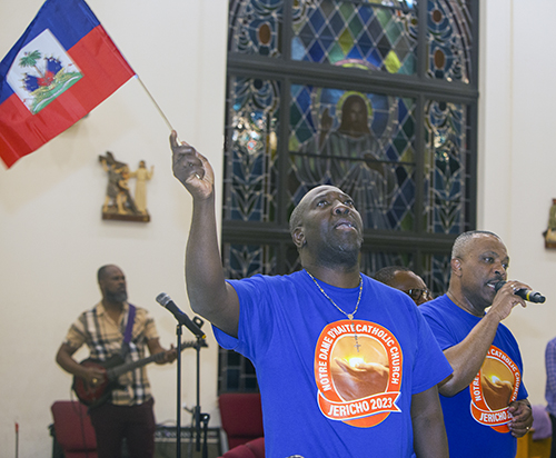 Benedict LaMartine sings in the choir on the third night of Notre Dame d'Haiti's annual celebration of Jericho, Oct. 15-21, 2023, in Miami.