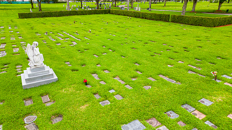 View of the Garden of the Holy Innocents at Our Lady of Mercy Cemetery in Doral, with some of the markers already placed on the grave sites of children who died in infancy or due to miscarriage. 63 markers were made possible by a donation to the cemetery, but the number of children's graves is nearly 1,000. The Footprints in the Garden campaign aims to get markers for all of them.