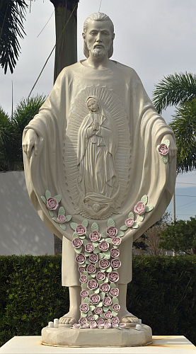 Statue of St. Juan Diego presents his cloakful of roses at the entrance to grounds of Our Lady of Guadalupe, Doral.