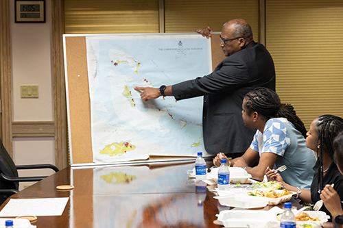 Archbishop Patrick C. Pinder of Nassau, Bahamas, meets with a Catholic Charities and Catholic communications delegation at his offices to discuss recovery progress following the Category 5 Hurricane Dorian in 2019. Dorian struck the Bahamas in early September of that year and has been characterized as the worst cyclone to ever strike the islands, with sustained winds of 185 mph.
