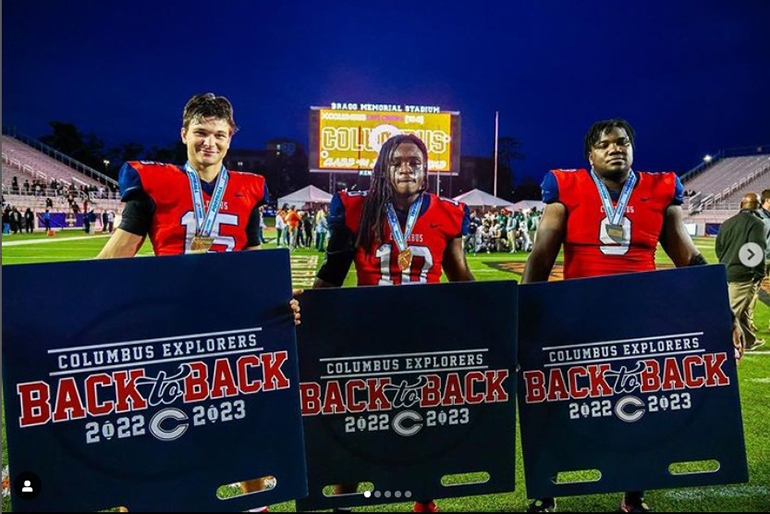 Christopher Columbus players point out their achievement -- back-to-back state championships -- after defeating Mandarin 38-19 Dec. 8, 2023, at Bragg Memorial Stadium in Tallahassee.