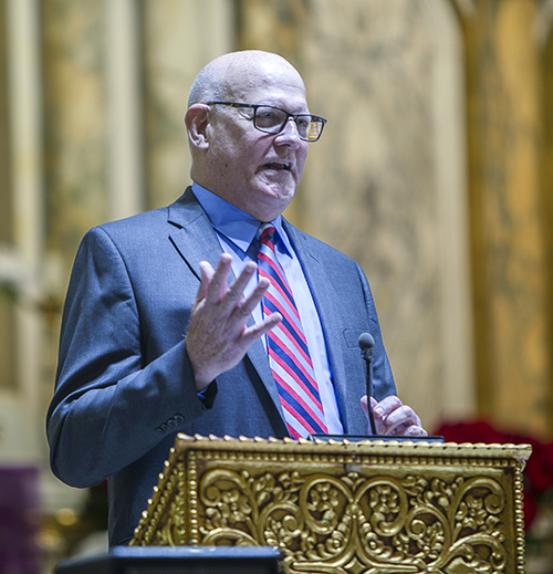 Judge John J. O'Sullivan, the 2023 Lex Christi, Lex Amoris awardee of the Miami Catholic Lawyers Guild, speaks at the conclusion of the group's annual Red Mass, celebrated Dec. 11 by Archbishop Thomas Wenski at Gesu Church in downtown Miami.