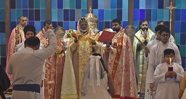 Bishop Philipos Mar Stephanos Thottathil, in gold vestments at center, celebrates Qurbono, an Indian Mass, at Nativity Church in Hollywood Jan. 14, 2024. The Mass was part of his visit to St. Mary's Syro-Malankara Church, which worships at Nativity.