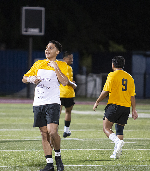 Seminarian Abelardo Garcia (23) wishes his brother in Dallas a happy birthday after scoring a goal during the second annual Archbishop's Cup soccer game, played Jan. 26, 2024, on the field of St. Thomas University, Miami Gardens. The seminarians beat the priests 3-0.