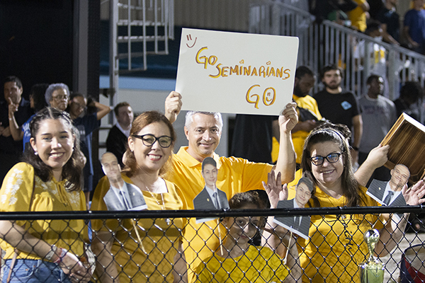 Fans show their support for seminarians from St. Katharine Drexel in Weston and Our Lady of Guadalupe in Doral during the second annual Archbishop's Cup soccer game, played Jan. 26, 2024, on the field of St. Thomas University, Miami Gardens.The seminarians beat the priests 3-0.