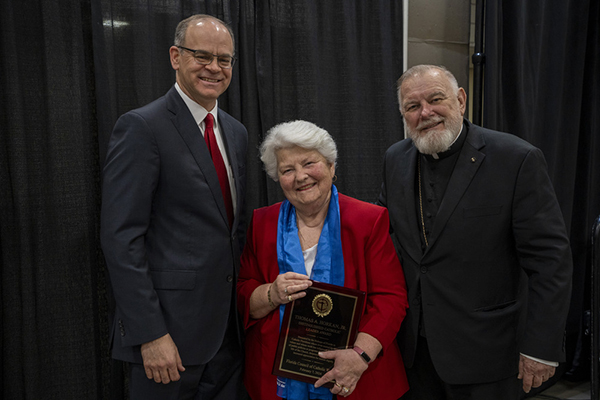 Brenda Dolan, president/province director of the Florida Council of Catholic Women, accepts the Thomas A. Horkan Jr., Distinguished Catholic Leader Award on behalf of the Council members, accompanied by Archbishop Thomas Wenski and Michael B. Sheedy, executive director of the Florida Conference of Catholic Bishops, Feb. 7, 2024. Members of the Florida Council of Catholic Women can be found all around the state of Florida, making a tremendous impact through faithful service in their parishes and communities. Catholic Days at the Capitol has benefited from the attendance of FCCW members for many years.