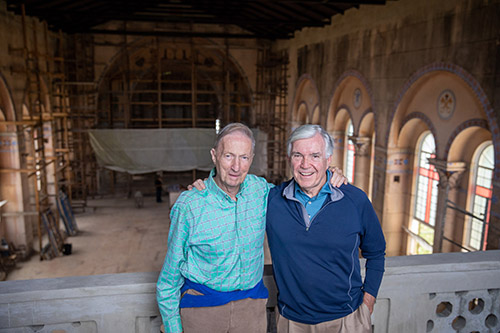 Father Pat O'Neill, left, a retired Augustinian priest in the Archdiocese of Miami, and Catholic Extension Society’s president, Father Jack Wall, pose in 2019 at the Santo Tomás de Villanueva campus chapel before restoration of the chapel was completed. (OSV News photo/courtesy Catholic Extension Society)
