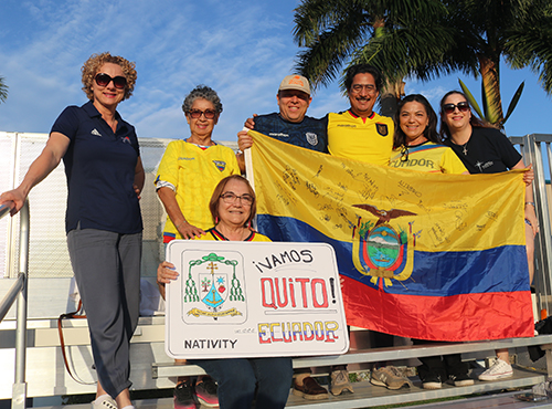 The Chang family, dressed in Ecuadorian national soccer team jerseys, their flag and a banner, cheered on the team of priests from the Archdiocese of Quito, Ecuador, who faced the priests of the Archdiocese of Miami in the International Clericus Cup April 23, 2024 on the soccer field at St. Thomas University in Miami Gardens. The final score was 3-2 in favor of Miami. (ROCIO GRANADOS | LVC)