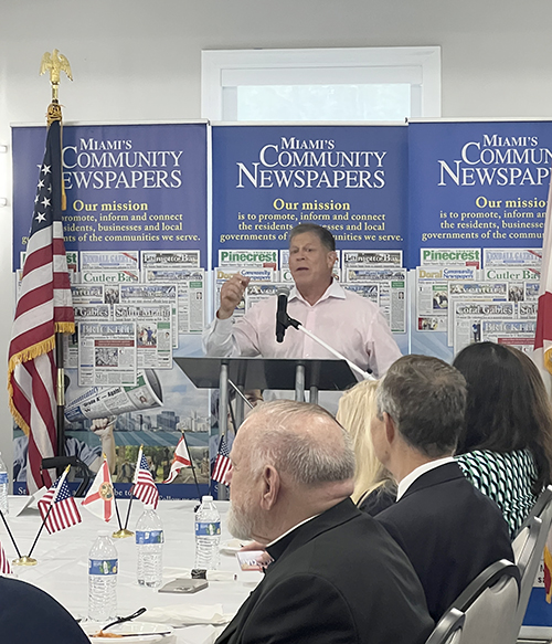 Grant Miller, publisher of Miami’s Community Newspapers, speaks at the Miami’s Community News Pinecrest Luncheon with Archbishop Thomas Wenski, May 15, 2024, at Evelyn Greer Park, in Pinecrest. He and his brother Michael, the co-publisher, organize luncheons monthly, a gathering of locals and Miami leaders such as Archbishop Wenski, who spoke at this month’s event.