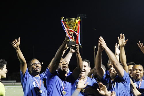 Archdiocese of Miami priests raise the trophy in celebration at the Clericus Cup International soccer match against the Archdiocese of Quito, Ecuador. The game was played April 23, 2024 on the soccer field at St. Thomas University in Miami Gardens, with a 3-2 win in favor of Miami.