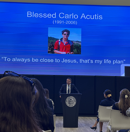 Luca Tizzano, teacher and campus minister at Saint Francis Catholic Academy in Gainesville, delivers the keynote address at the Blessed Carlo Acutis Virtual Academy (CAVA) Inaugural Mass and Blessing Ceremony May 29, 2024, at St. Brendan High School in Miami. Tizzano talked about Blessed Carlo Acutis’s life, spirituality, and impact.