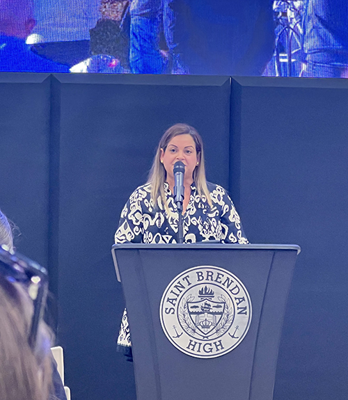 Rebeca Bautista, principal of the Blessed Carlo Acutis Virtual Academy (CAVA), speaks at the CAVA Inaugural Mass and Blessing Ceremony May 29, 2024, at St. Brendan High School in Miami.