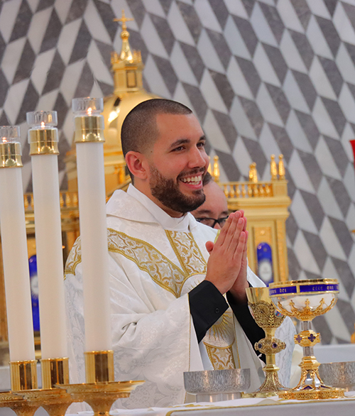 Newly-ordained Father Michael Anthony Martínez takes part in the celebration of Mass alongside Archbishop Thomas Wenski, June 1, 2024, at Our Lady of Belen Chapel in Miami.