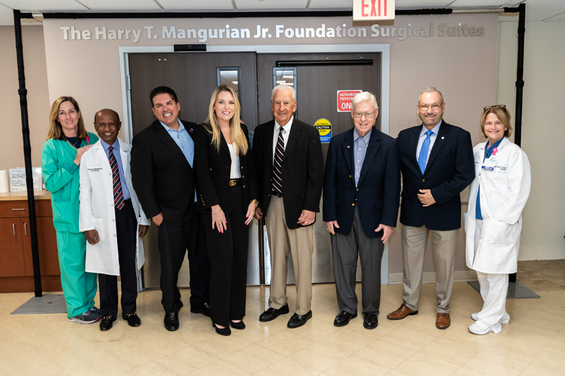 Holy Cross Health's leadership team poses outside of the newly renovated and dedicated surgical suites named after The Harry T. Mangurian Jr. Foundation, which donated  million to the hospital in Fort Lauderdale. From left to right is Christine Marrero, executive director of surgical services; Doctor Karan Munuswamy; Mark Doyle, president and CEO; Laura Denoux, vice president and Chief Development Officer; Steve Mehallis, president of The Harry T. Mangurian Jr. Foundation, and Gordon Latz, vice president; Rudy Molinet, RN, chair of the Holy Cross Board of Directors; and Taren O'Brien, chief nursing officer.